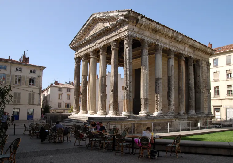 Terrace cyclists in front of the Roman temple of Augustus and Livia in Vienna