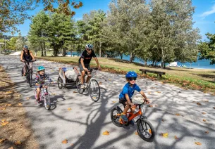 Family cycling on the green route